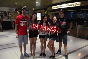 Optiva Signs celebrates the Blackhawks' Stanley Cup win by having fans pose with a portable, battery-powered “DA’ HAWKS” SpellBrite sign.